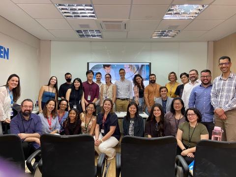 ABE Brazil team, students and teachers visiting the Amgen Brazil Lab