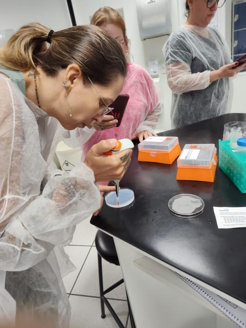Teacher practing pipetting in a gel
